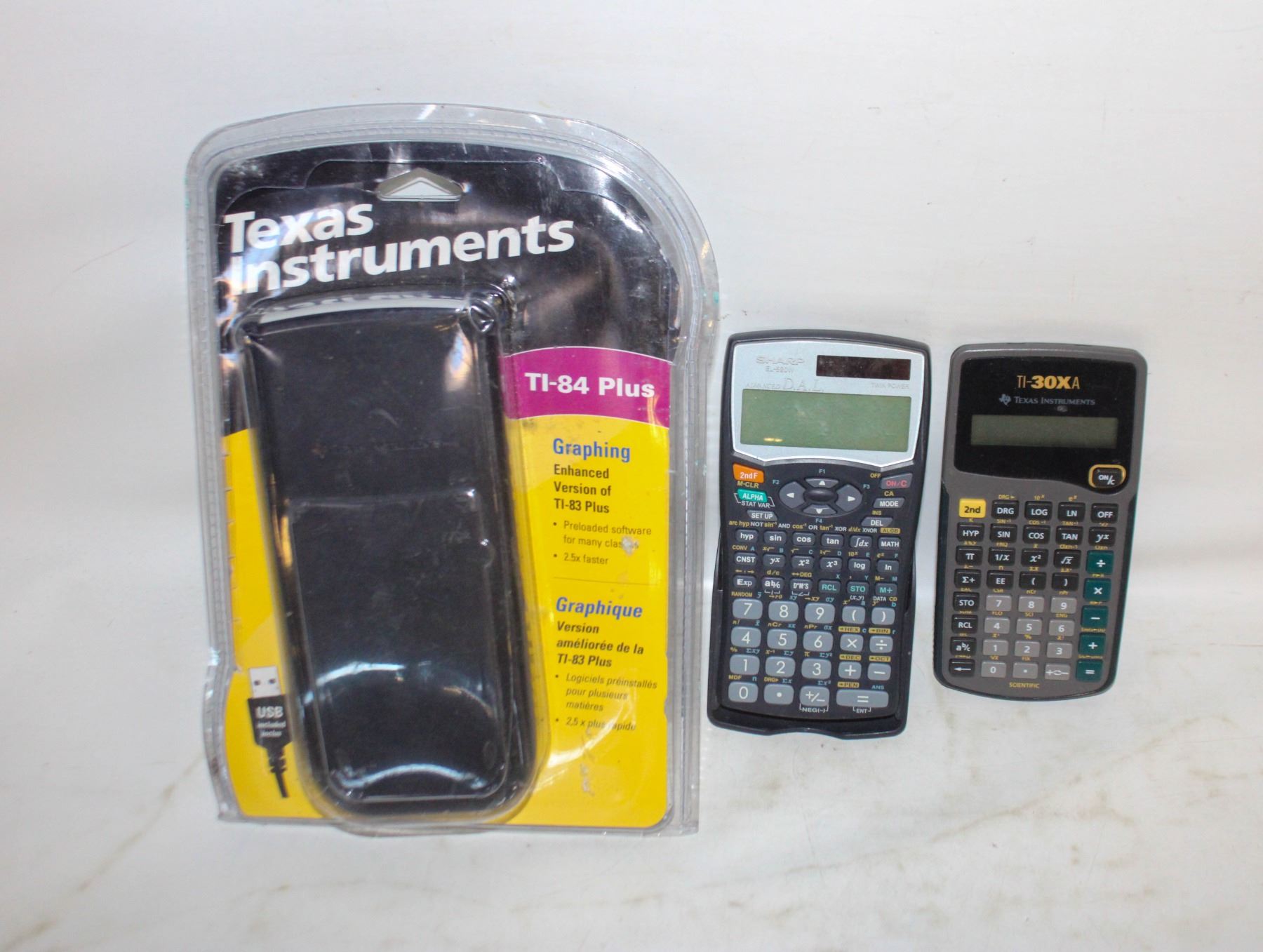 LOT OF CALCULATORS. ONE TEXAS INSTRUMENTS