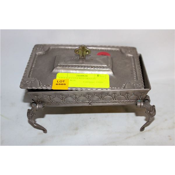 VINTAGE COVERED ORNATE FOOTED BOX.