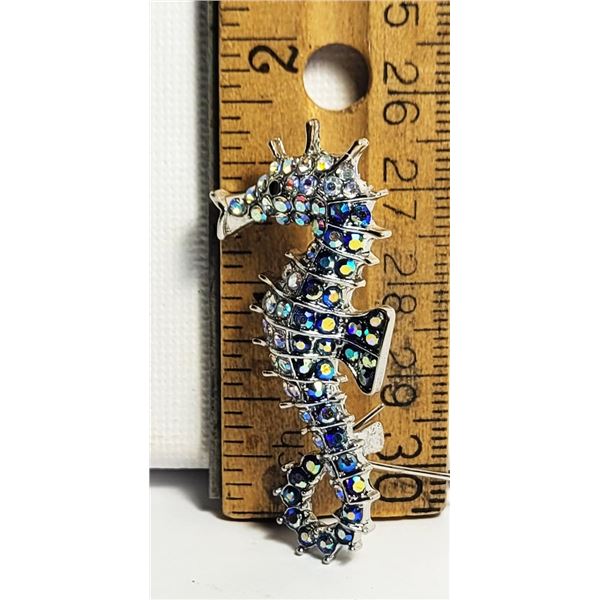 18)  SILVER TONE WITH RAINBOW COLORED