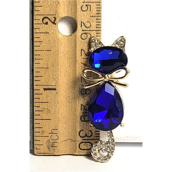 17)  GOLD TONE WITH SAPPHIRE BLUE & CLEAR