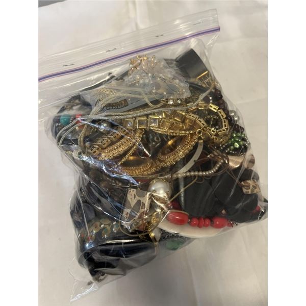 HEAVY LARGE BAG W/ LOTS OF MISC JEWELRY AND PARTS ETC