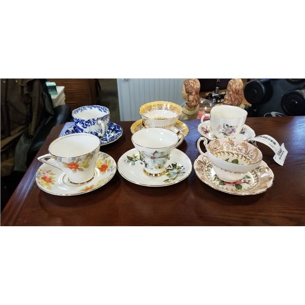 6 ANTIQUE CUP AND SAUCER SETS