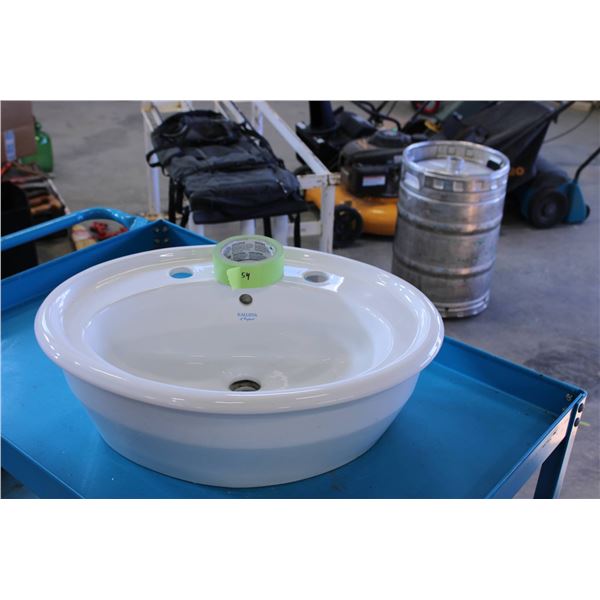 White ceramic drop-in sink featuring three pre-drilled faucet holes. 