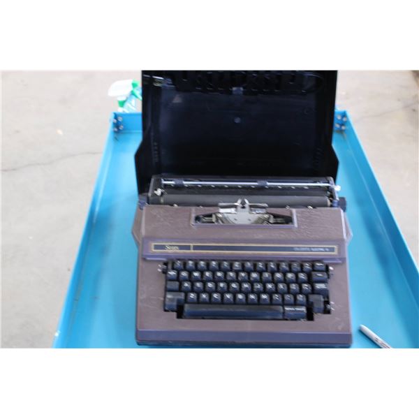 Sears Celebrity Electric 12 typewriter featuring a plastic housing with brown finish and black keys.