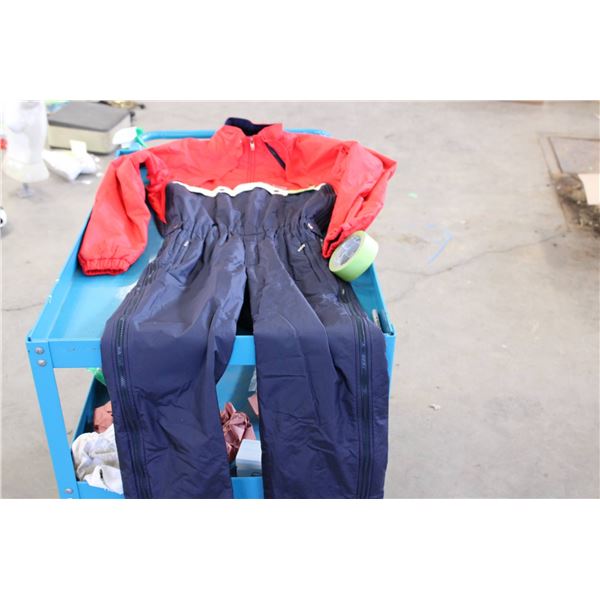 Descente red and blue kids' ski suit featuring a zippered front closure, snap detailing, and fleece 