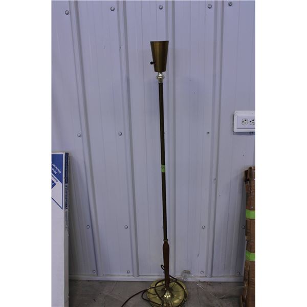 Vintage floor lamp featuring a brass and wood construction. The lamp includes a weighted brass base 