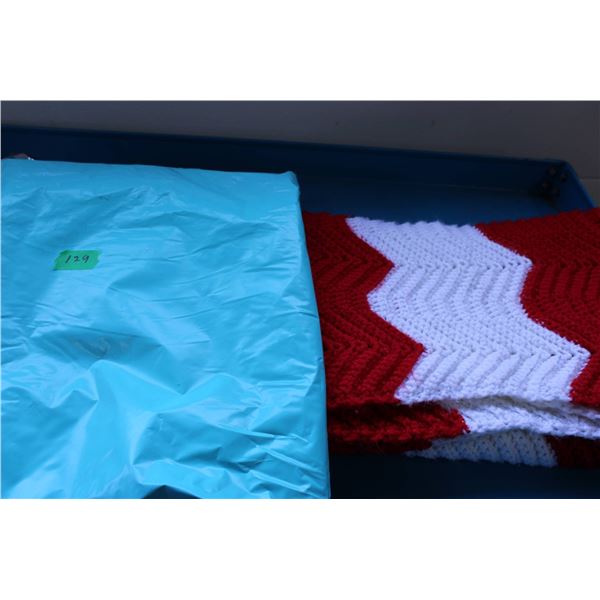Hand crocheted quilt featuring a red and white chevron pattern