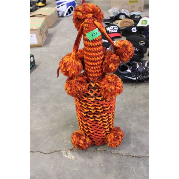 Hand-crocheted Texas Mickey bottle cover from the 1970s. Made with orange and red yarn