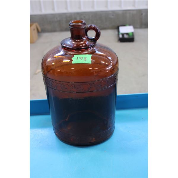 Amber Glass Jug with Handle and Raised Decorations

