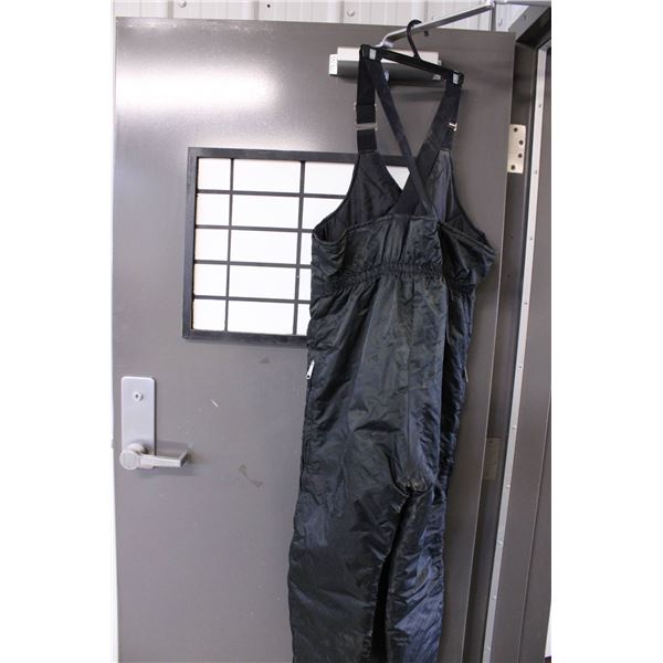 Black insulated bib overalls featuring adjustable shoulder straps and a front zipper closure