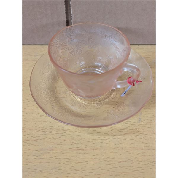 Pink depression glass cup and saucer Apple Blossom pattern