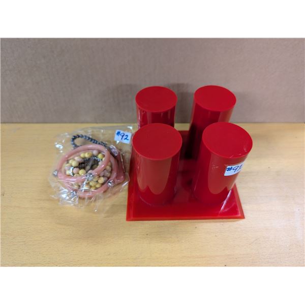 Red jewellery display and bracelets