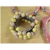 Image 4 : Red jewellery display and bracelets