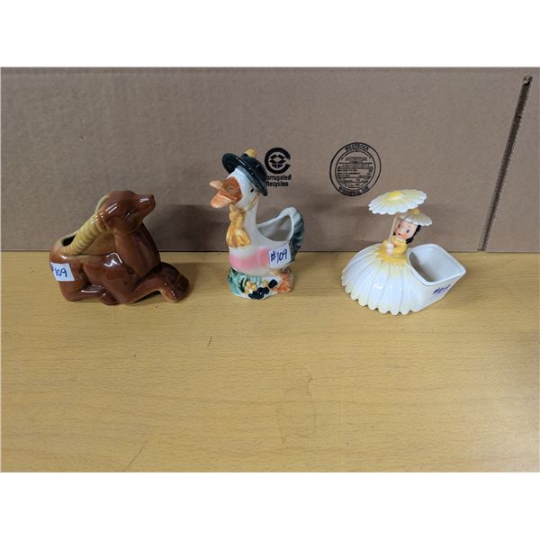 Air fern holders, duck, wildebeest, girl with umbrella