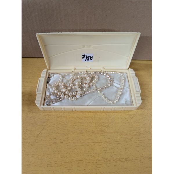 3 strings of faux pearls