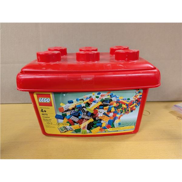 Red Lego tub with misc Lego and booklets