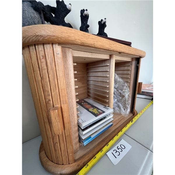CD shelf with sliding doors, ceramic bears, some cds