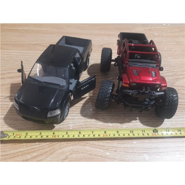 Black Kubota Truck and Red Monster Truck.
