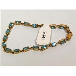 10K Gold Bracelet With 1ctw Oval Blue Topaz