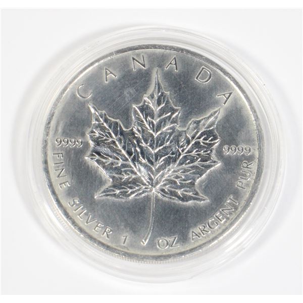 1 OZ 2011 CANADA SILVER MAPLE. COIN HAS SOME MILKING