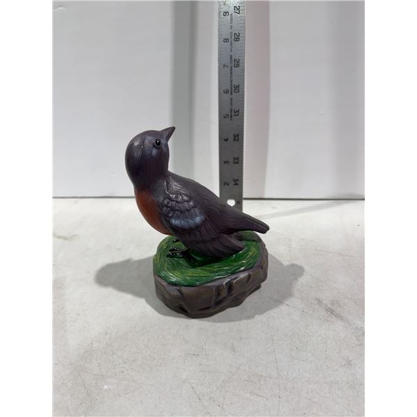 Noise making bird figurine