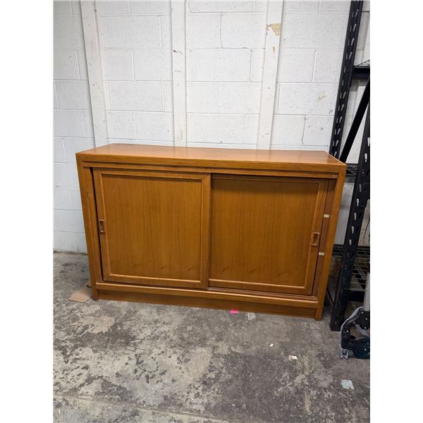 Display cabinet one side has sliding doors. Other side is wide open measures 59" x 19 1/2" x 39 1/2"