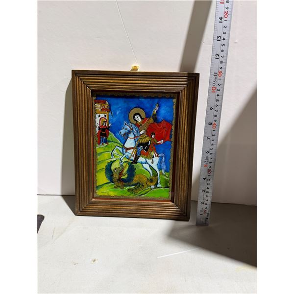 vintage Romanian reverse glass painting icon depicting Saint George slaying the dragon.