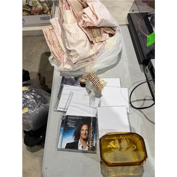 Curtains lidded jar, damaged CDs and shells