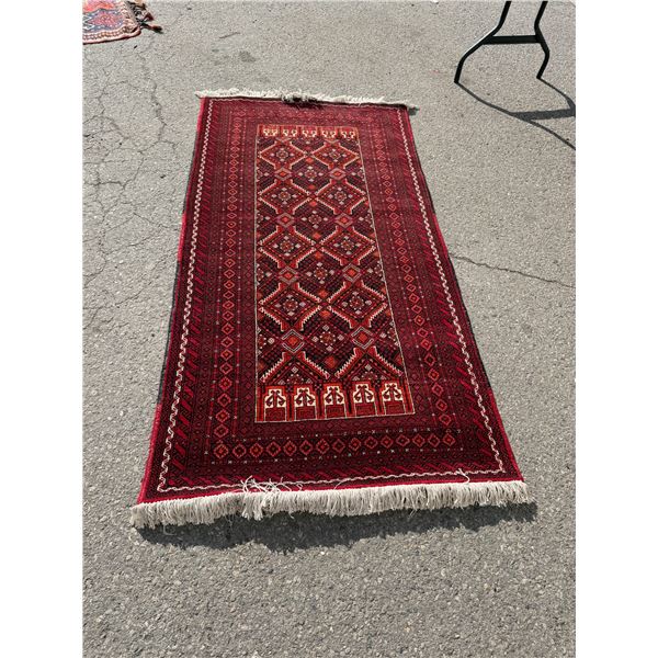 Area carpet measures 80" x 40"