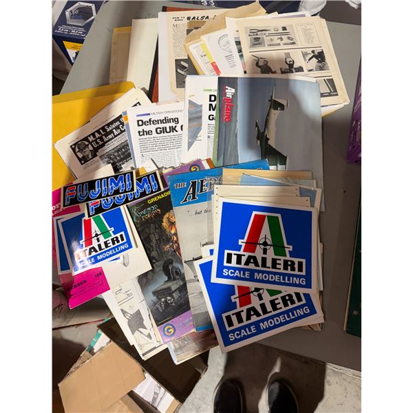 Assorted stickers and airplane and other items