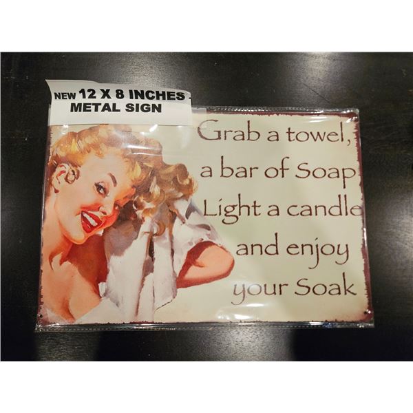 Metal sign "grab a towel"