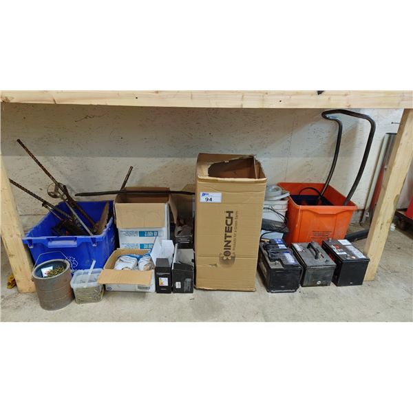 SHELF OF ASSORTED ITEMS INCLUDING; CAR BATTERIES, PAINT MIXING BITS, PAPER TOWEL & MORE