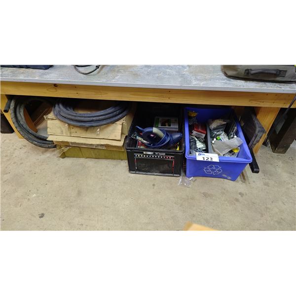 SHELF OF ASSORTED ITEMS INCLUDING; ELECTRIC STAPLER, RUBBER CONDUIT, HARDWARE & MORE