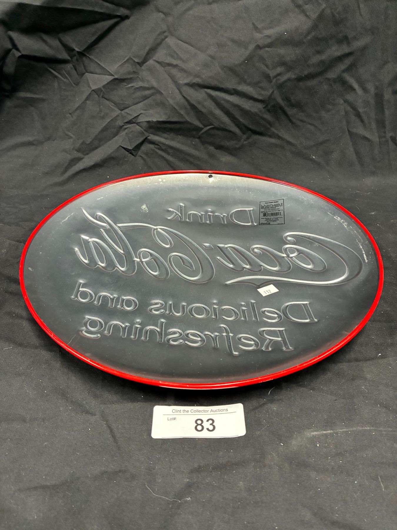 Mint condition embossed metal Coca-Cola button sign, made by Coke, 14