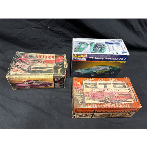 3 vintage model kit boxes with various pieces inc NIB Shelby Mustang
