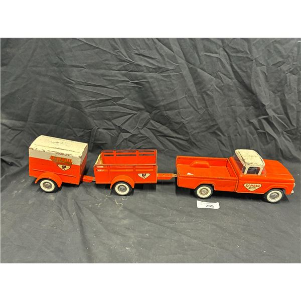 Rare pressed steel Nylint U-Haul truck with 2 different U-Haul trailers, truck is 14"