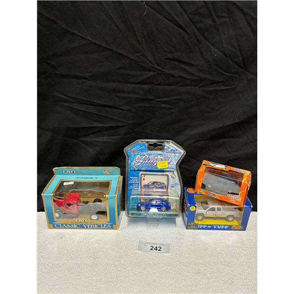 4 die cast vehicles NIB