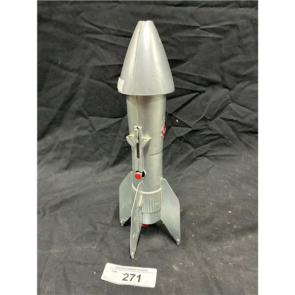 Vintage toy rocket bank, has change inside 11"