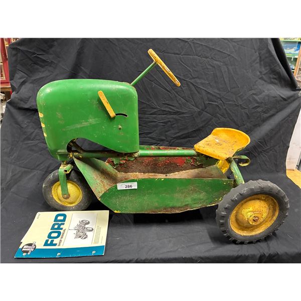 Vintage metal pedal tractor 29" long