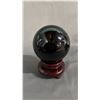 Image 1 : 4" BLACK ONYX SPHERE ON ROTATING WOOD STAND