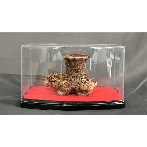MOTTLED YELLOW WINE VESSEL IN DISPLAY CASE