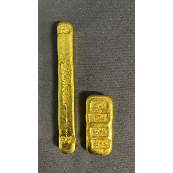 (2) STAMPED SCRIPT PAPER WEIGHTS