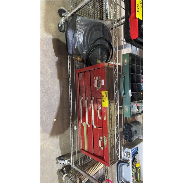 SHELF OF ASSORTED ITEMS INCLUDING TOOL BOX AND HOSE AND CAR MATS