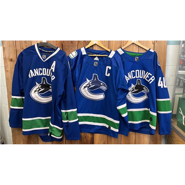 (3) ASSORTED VANCOUVER CANUCKS HOCKEY JERSEYS INCLUDING; ADIDAS ELIAS PETTERSSON SIZE 54, ADIDAS