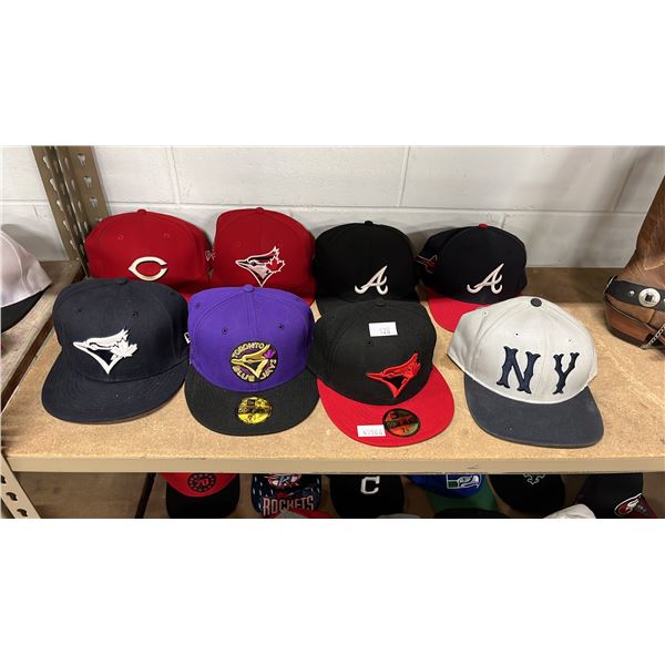 SHELF OF ASSORTED HATS INCLUDING; TORONTO BLUE JAYS, CINCINNATI REDS, ATLANTA BRAVES & MORE