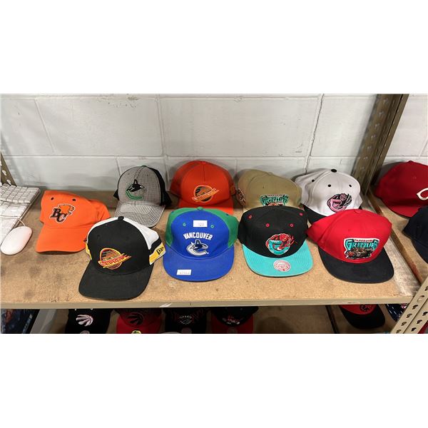 SHELF OF ASSORTED HATS INCLUDING; VANCOUVER CANUCKS, BC LIONS & VANCOUVER GRIZZLIES