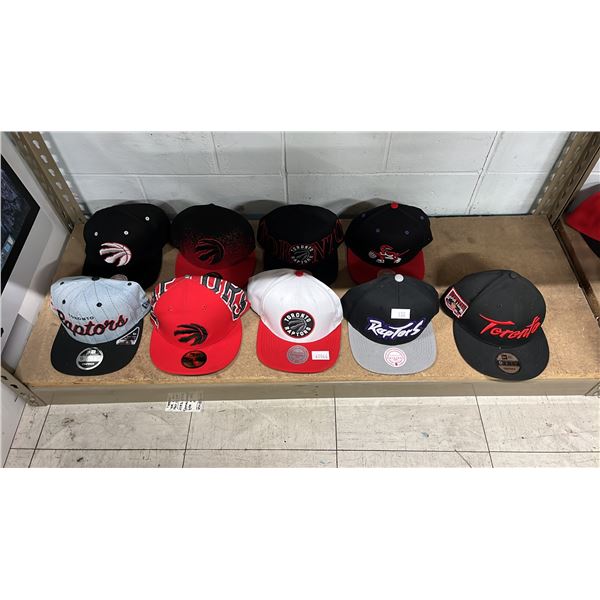 SHELF OF ASSORTED TORONTO RAPTORS HATS