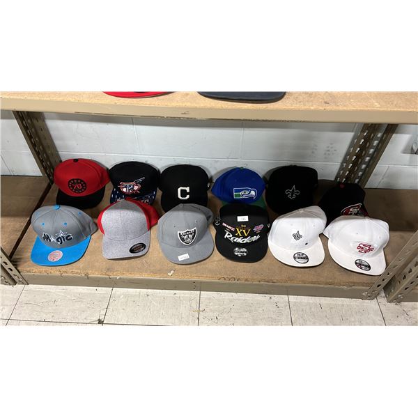 SHELF OF ASSORTED HATS INCLUDING; OAKLAND RAIDERS, ORLANDO MAGIC, SEATTLE SEAHAWKS & MORE