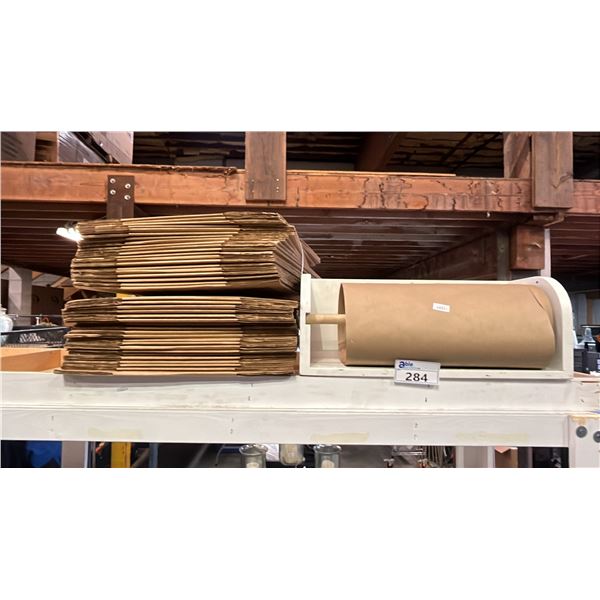 KRAFT PAPER ROLL IN WOOD DISPENSER (24.5"W X 9.5"T X 9.5"D) & STACK OF CARDBOARD BOXES