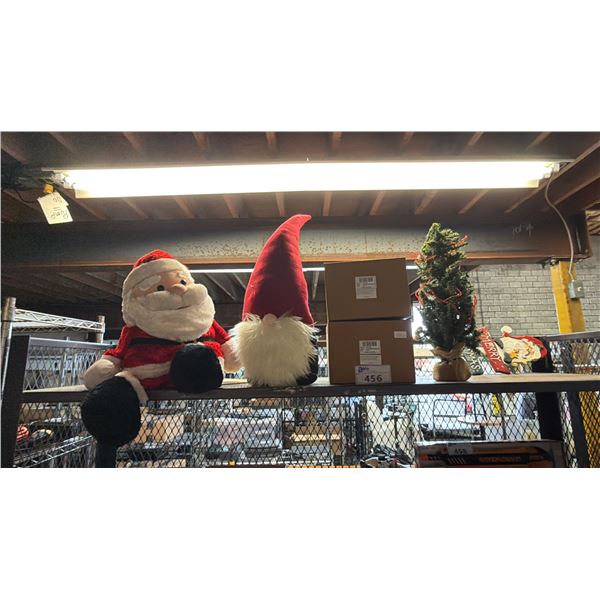 SHELF OF ASSORTED CHRISTMAS DECOR: PLUSH SANTA, CHRISTMAS GNOME, NUTCRACKER STOCKING HOOKS & MORE